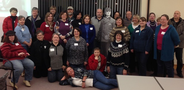 Some of our guests in a group photograph with Mr. Holmes during their visit.