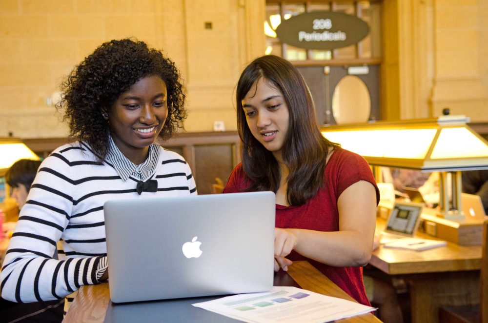 One-of-our-Peer-Research-Consultants-working-with-a-student-in-Walter-Library