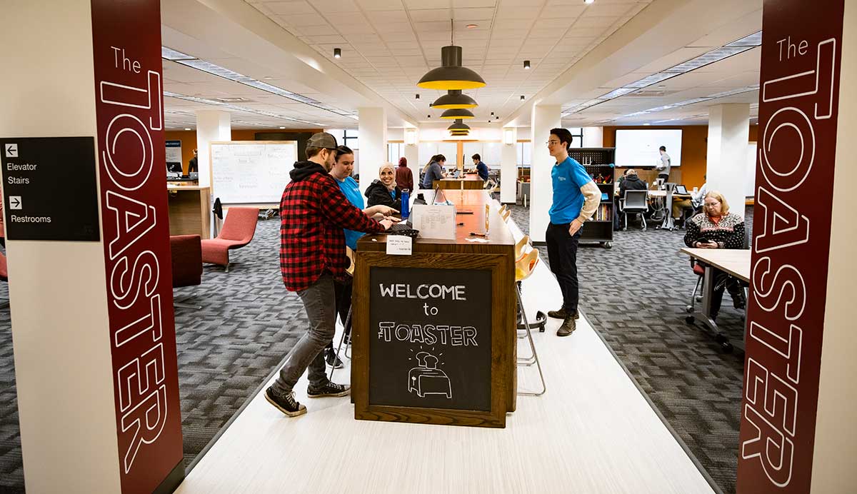 The Toaster entrance with students talking. 