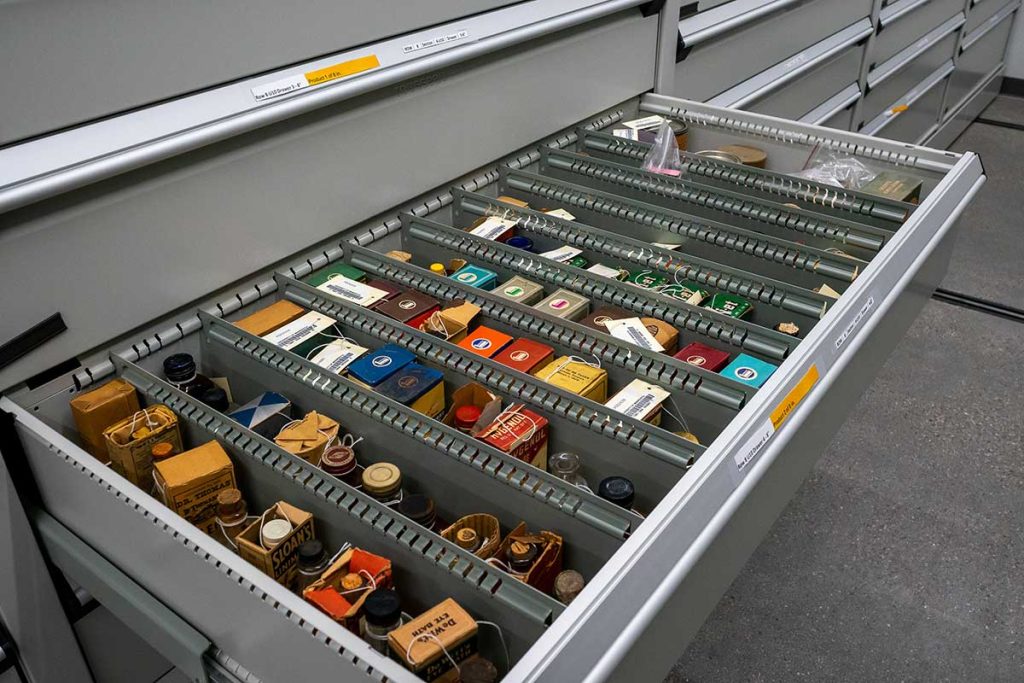 drawer filled with small artifacts from the Wangensteen Library collection