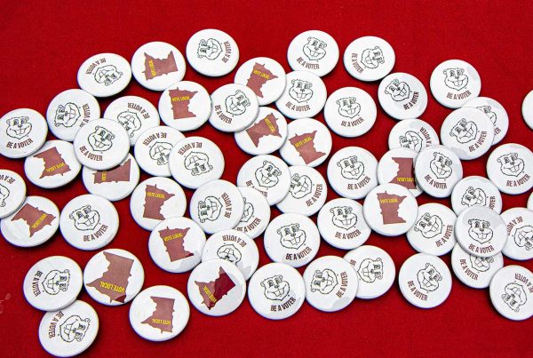 Be a voter buttons at the Academic Success Fair.