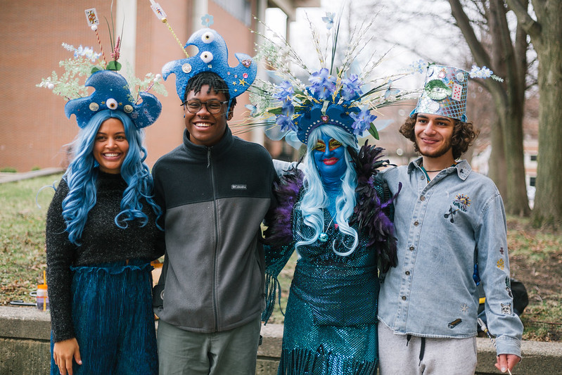 The Blue Lady with guests wearing artistic blue hats