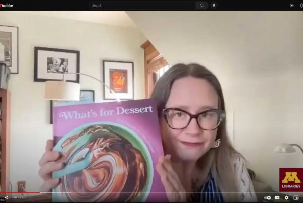 Megan Kocher holding the book "What's for Dessert"
