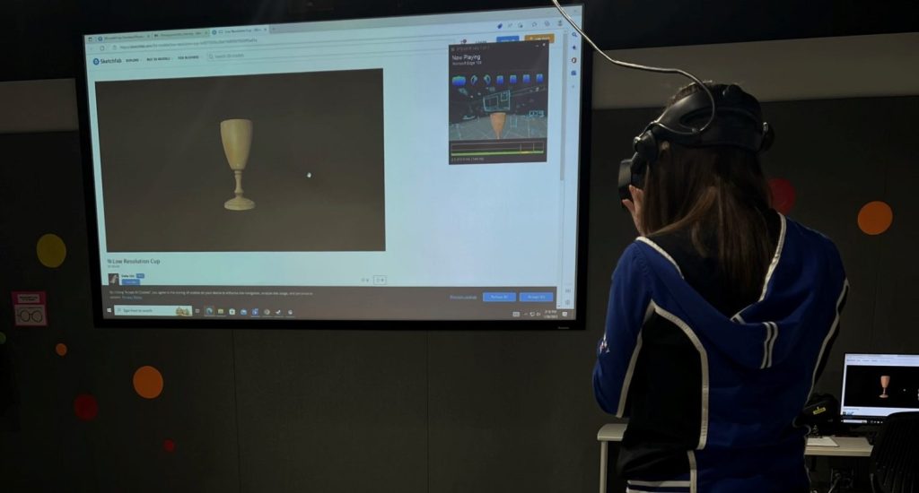 A library staff member experiences the 3D model in virtual reality