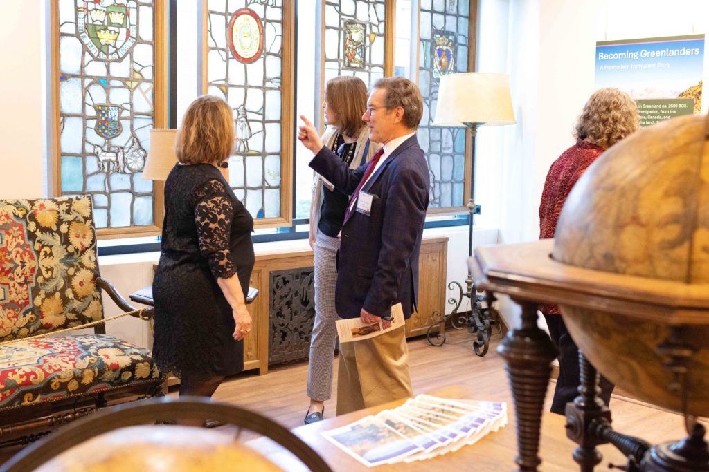 Attendees at the Bell Room's grand opening admire the stained-glass windows.