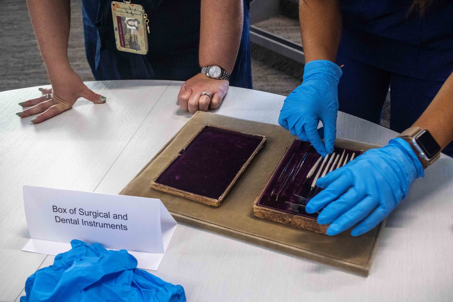 Students handle rare dental tools made with ivory. (Photo/Adria Carpenter)