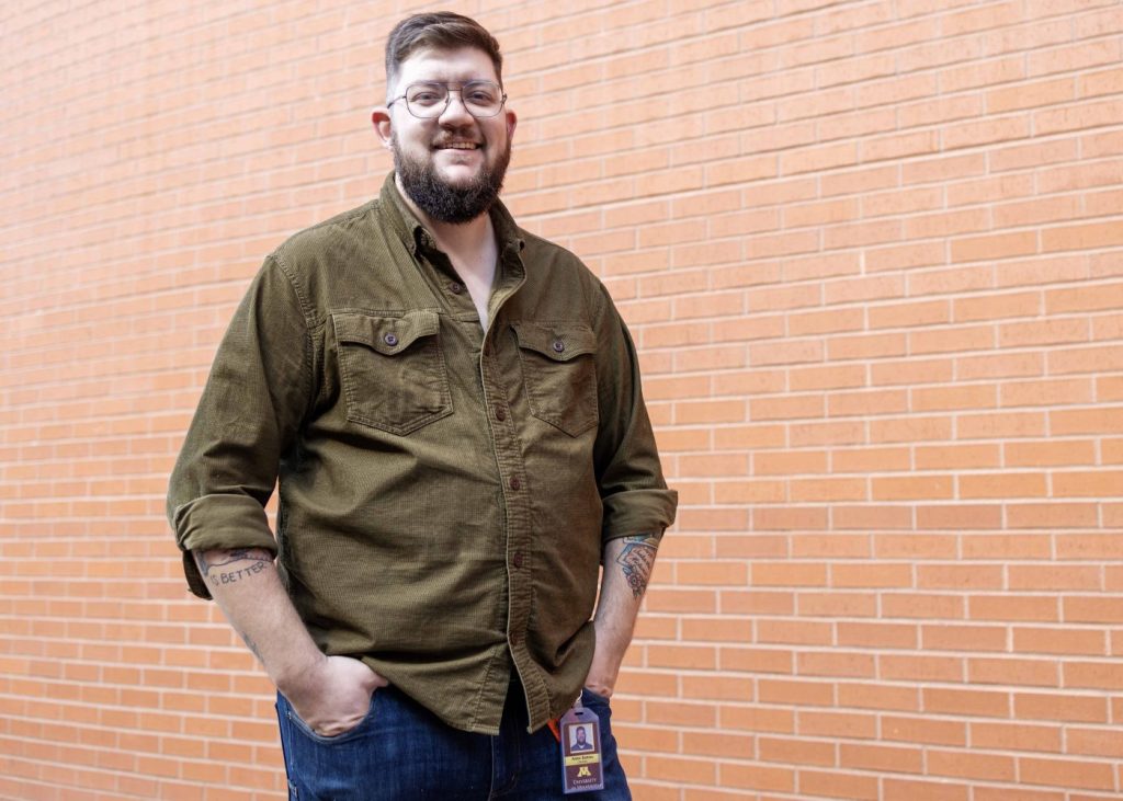 Aiden Bettine, curator of the Tretter Collection, poses for a portrait on April 25, 2023. (Photo/Adria Carpenter)