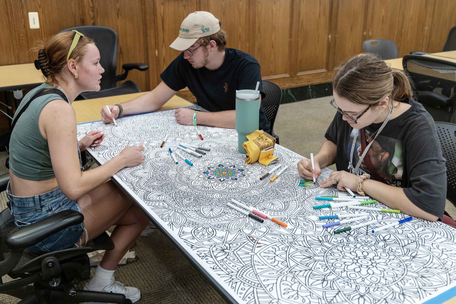 Students in the Chill Zone room color a community mandala. (Photo/Adria Carpenter)