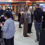 Guests gather, talk, and eat foot at the Symbolic Significance exhibit opening event on Monday, Sept. 11, 2023. (Photo/Adria Carpenter)