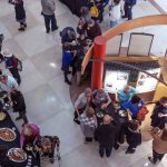 Guests gather, talk, and eat foot at the Symbolic Significance exhibit opening event on Monday, Sept. 11, 2023. (Photo/Adria Carpenter)