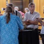 Guests gather, talk, and eat foot at the Symbolic Significance exhibit opening event on Monday, Sept. 11, 2023. (Photo/Adria Carpenter)