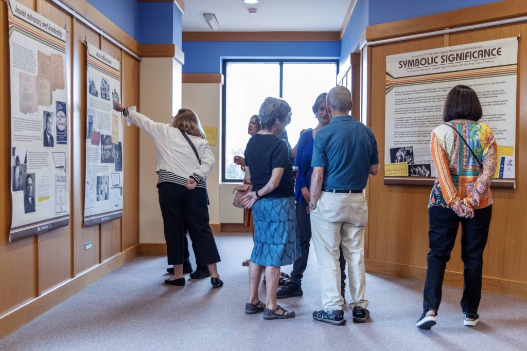 Attendees browse the Symbolic Significance exhibit opening event on Monday, Sept. 11, 2023. (Photo/Adria Carpenter)