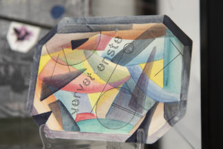 Mail art from the Stamped and Posted exhibit features watercolor art on paper with abstract, geometric shapes.