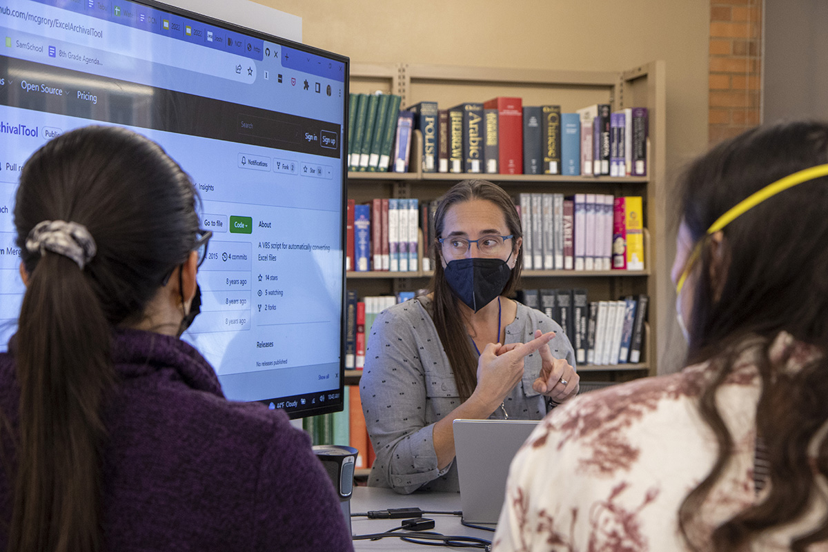 A researcher delivers a presentation to a small audience