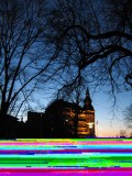 An example of a corrupted digital photo with the bottom portion pixilated and obscured.