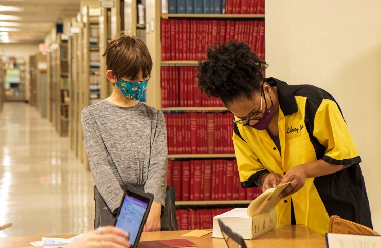 Library Guide helping a History Day student at Wilson Library.