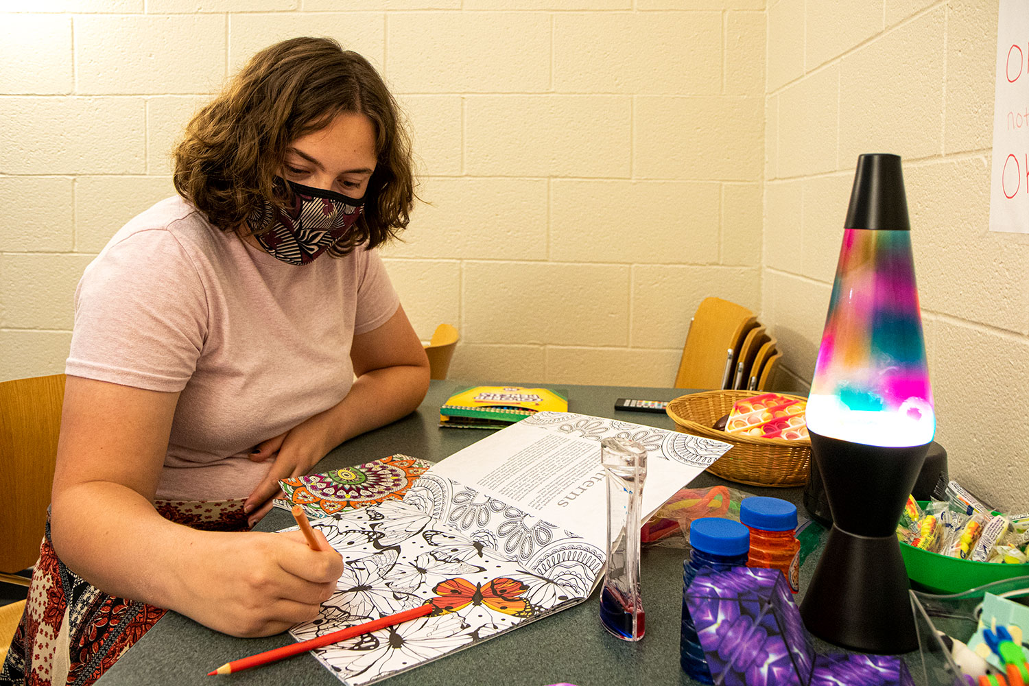 Student employee Grace tries out some of the stressbusters in the Sensory Room