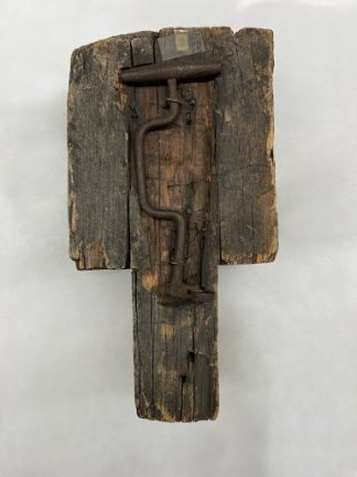 Tooth key fastened to wooden support