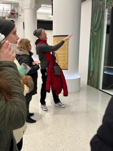 Darren Terpstra talks about the display windows with fellow Libraries staff members.