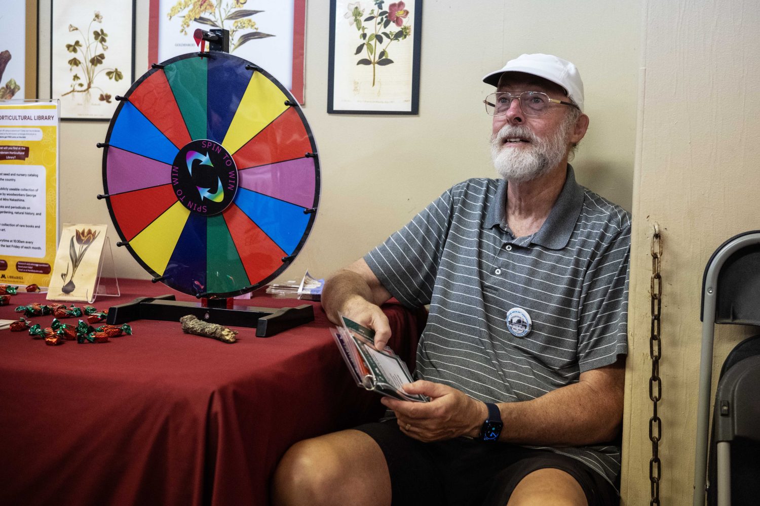 A volunteer at the Andersen Horticultural Library booth asks trivia questions at the Minnesota State Fair on Thursday, August 29, 2024. (Photo/Adria Carpenter)