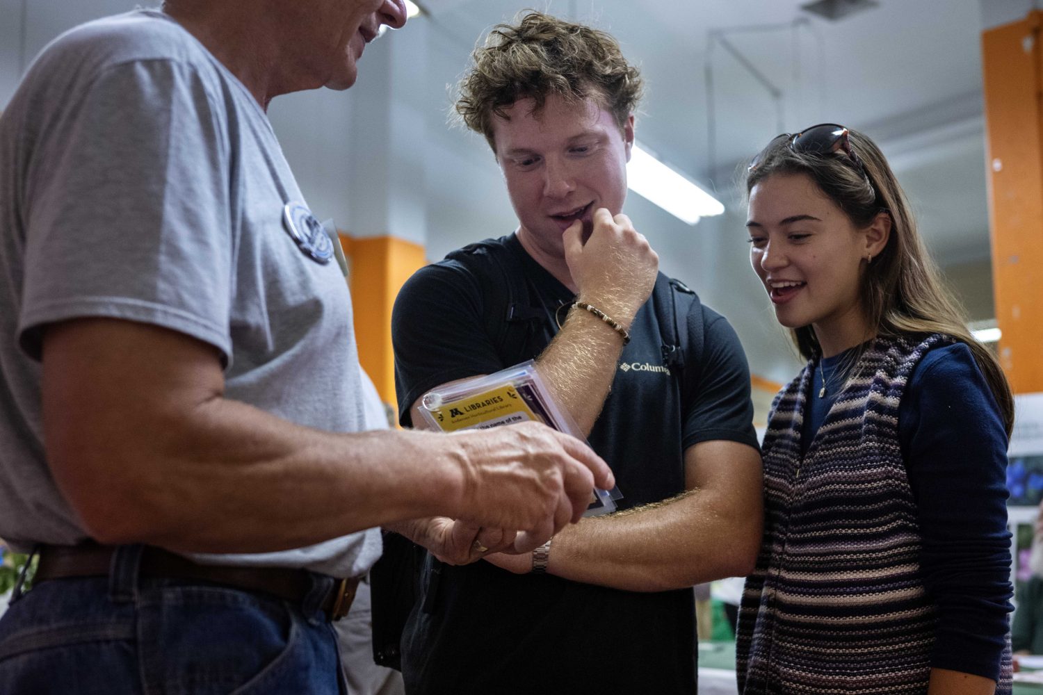 Attendees answer trivia questions at the Andersen Horticultural Library's booth at the Minnesota State Fair on Thursday, August 29, 2024. (Photo/Adria Carpenter)