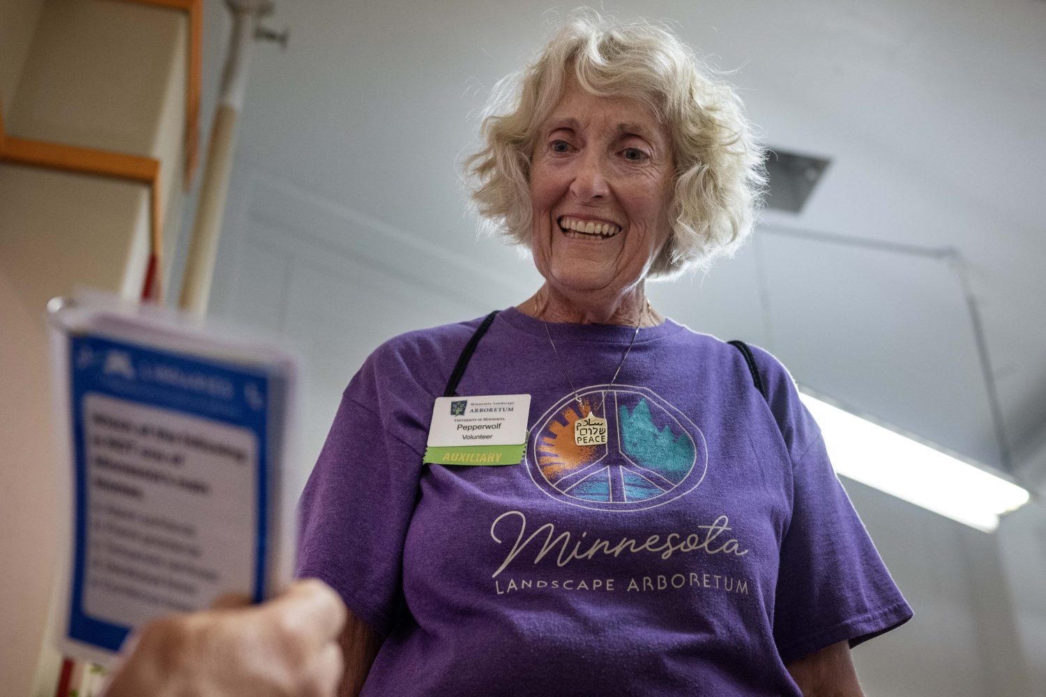A volunteer answers trivia questions at the Andersen Horticultural Library's booth at the Minnesota State Fair on Thursday, August 29, 2024. (Photo/Adria Carpenter)