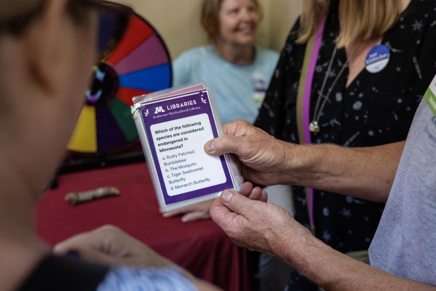 Attendees answer trivia questions at the Andersen Horticultural Library's booth at the Minnesota State Fair on Thursday, August 29, 2024. (Photo/Adria Carpenter)