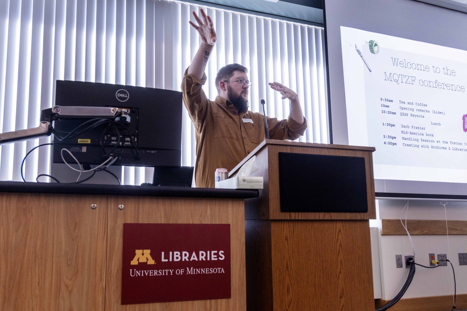 Aiden Bettine, curator of the Tretter Collection, speaks at the Midwest Queer and Trans Zine Fest conference at Andersen Library in Minneapolis on Friday, October 18, 2024. (Photo/Adria Carpenter)