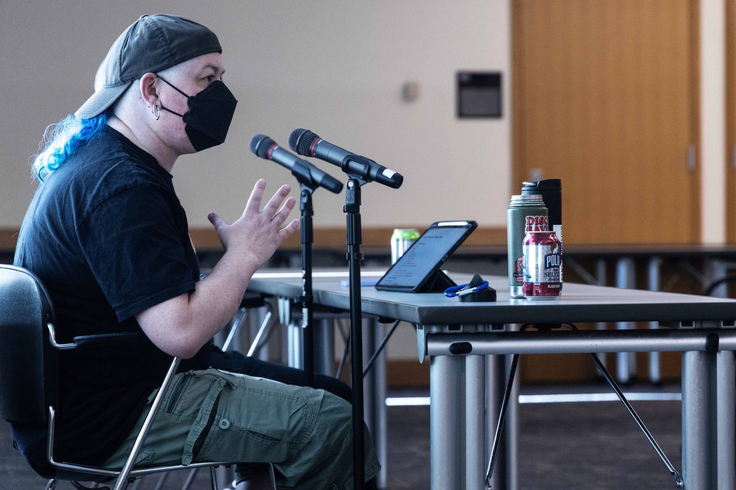 Milo Miller and Chris Wilde, co-founders of the Queer Zine Archives Project, speak at the Midwest Queer and Trans Zine Fest conference at Andersen Library in Minneapolis on Friday, October 18, 2024. (Photo/Adria Carpenter)