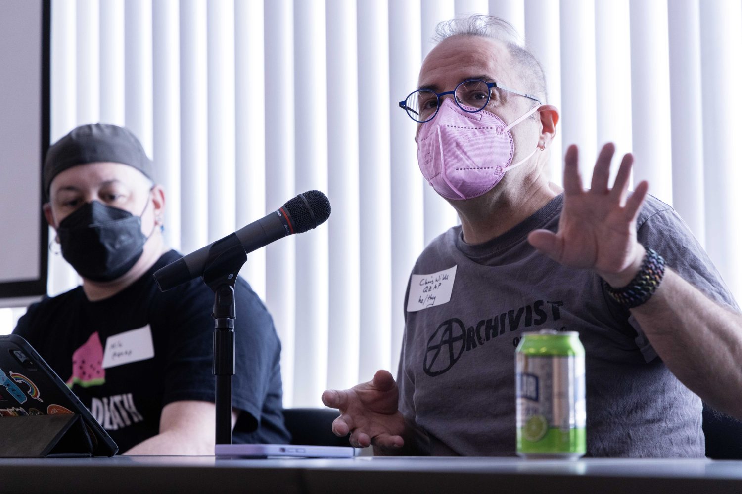 Milo Miller and Chris Wilde, co-founders of the Queer Zine Archives Project, speak at the Midwest Queer and Trans Zine Fest conference at Andersen Library in Minneapolis on Friday, October 18, 2024. (Photo/Adria Carpenter)