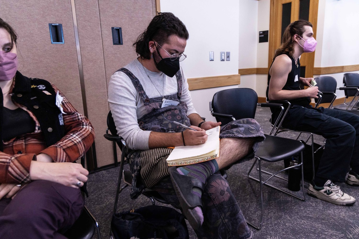 Attendees take notes during the Midwest Queer and Trans Zine Fest conference at Andersen Library in Minneapolis on Friday, October 18, 2024. (Photo/Adria Carpenter)