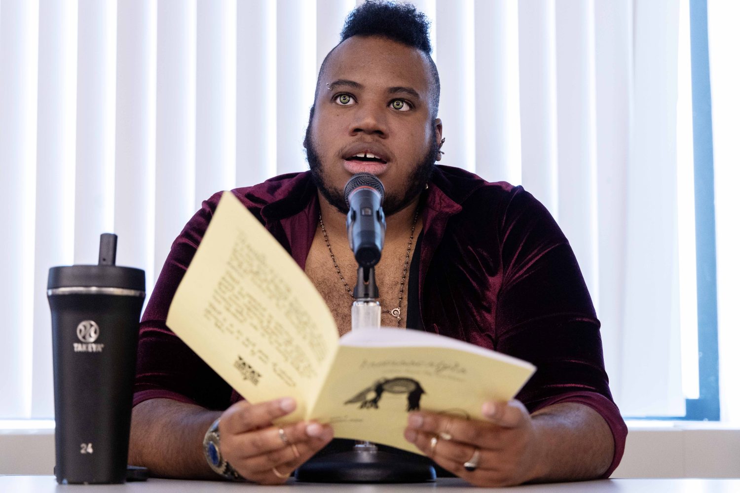 Jae Yates, oral historian at the Tretter Collection, speaks at the Midwest Queer and Trans Zine Fest conference at Andersen Library in Minneapolis on Friday, October 18, 2024. (Photo/Adria Carpenter)