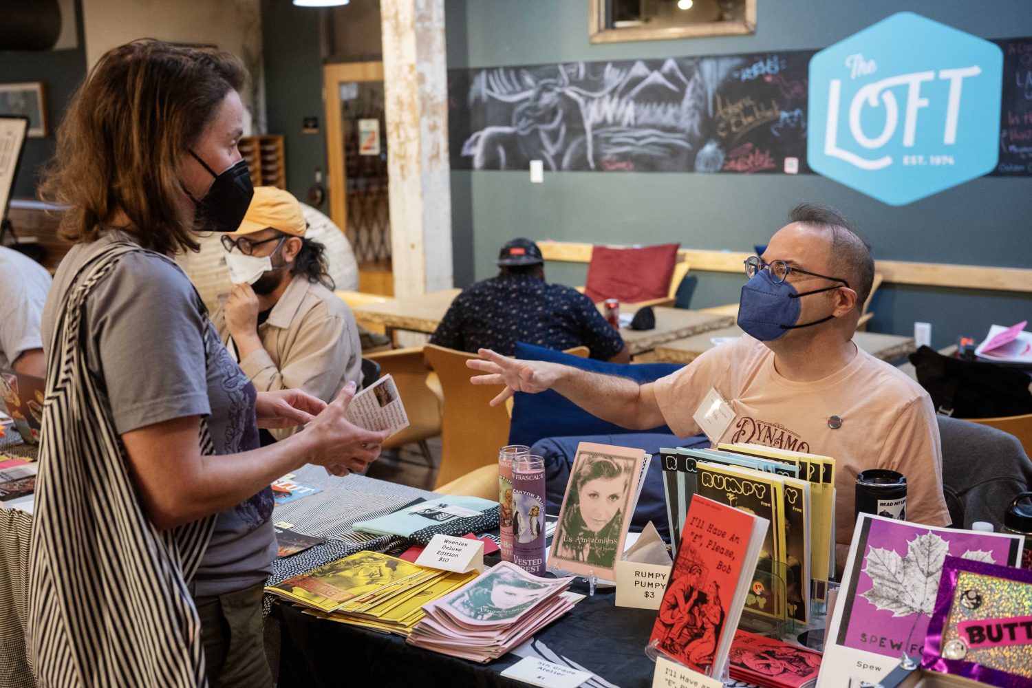 Chris Wilde, co-founder of the Queer Zine Archives Project, displays zines during the Midwest Queer and Trans Zine Fest, on Saturday, October 19, 2024. (Photo/Adria Carpenter)