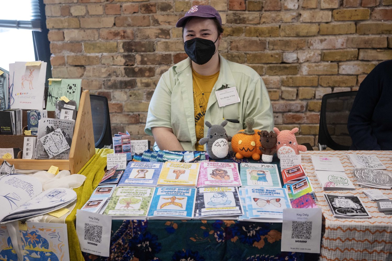 Key Daley, from Madison, Wisconsin, displays zines during the Midwest Queer and Trans Zine Fest, on Saturday, October 19, 2024. (Photo/Adria Carpenter)