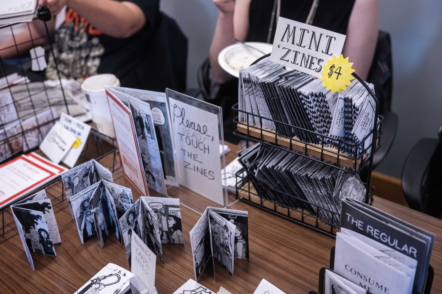 Oddcycle100, from Madison, Wisconsin, displays zines during the Midwest Queer and Trans Zine Fest, on Saturday, October 19, 2024. (Photo/Adria Carpenter)