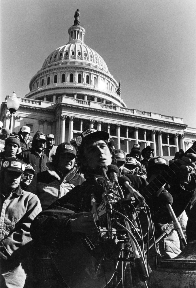 Larry Long performs on the steps of the United States Capitol with family farmers to stop farm foreclosures in 1979. (Photo/William Blanton)