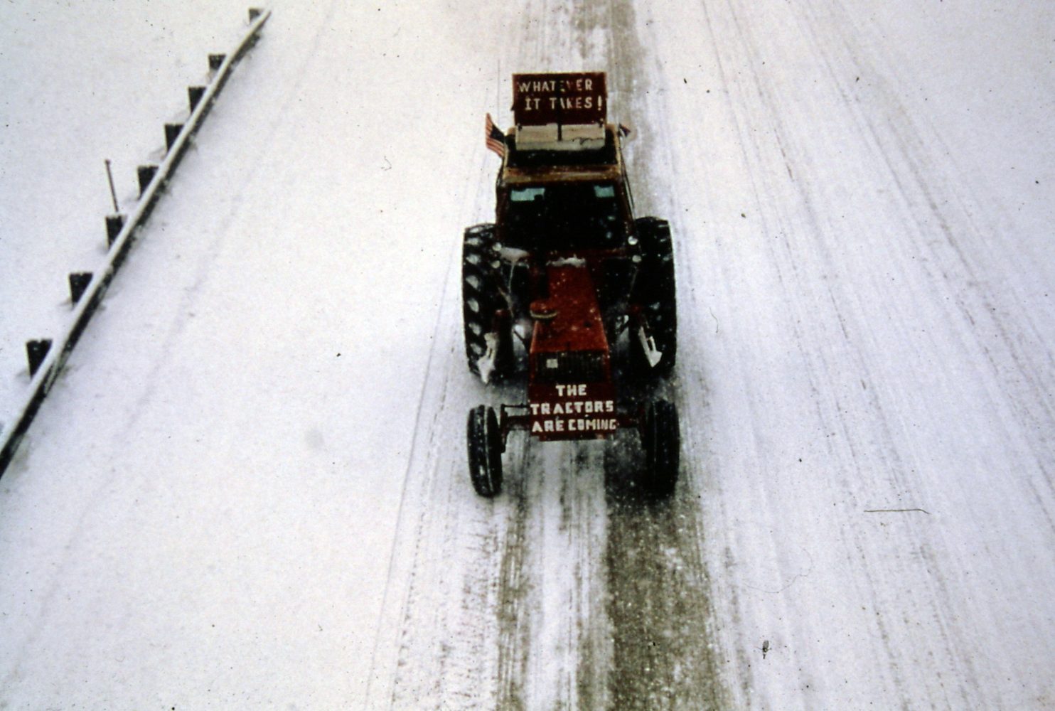 The tractorcade rolls down a snowy road. Image courtesy of the Performing Arts Archives. (Photo/Larry Long)