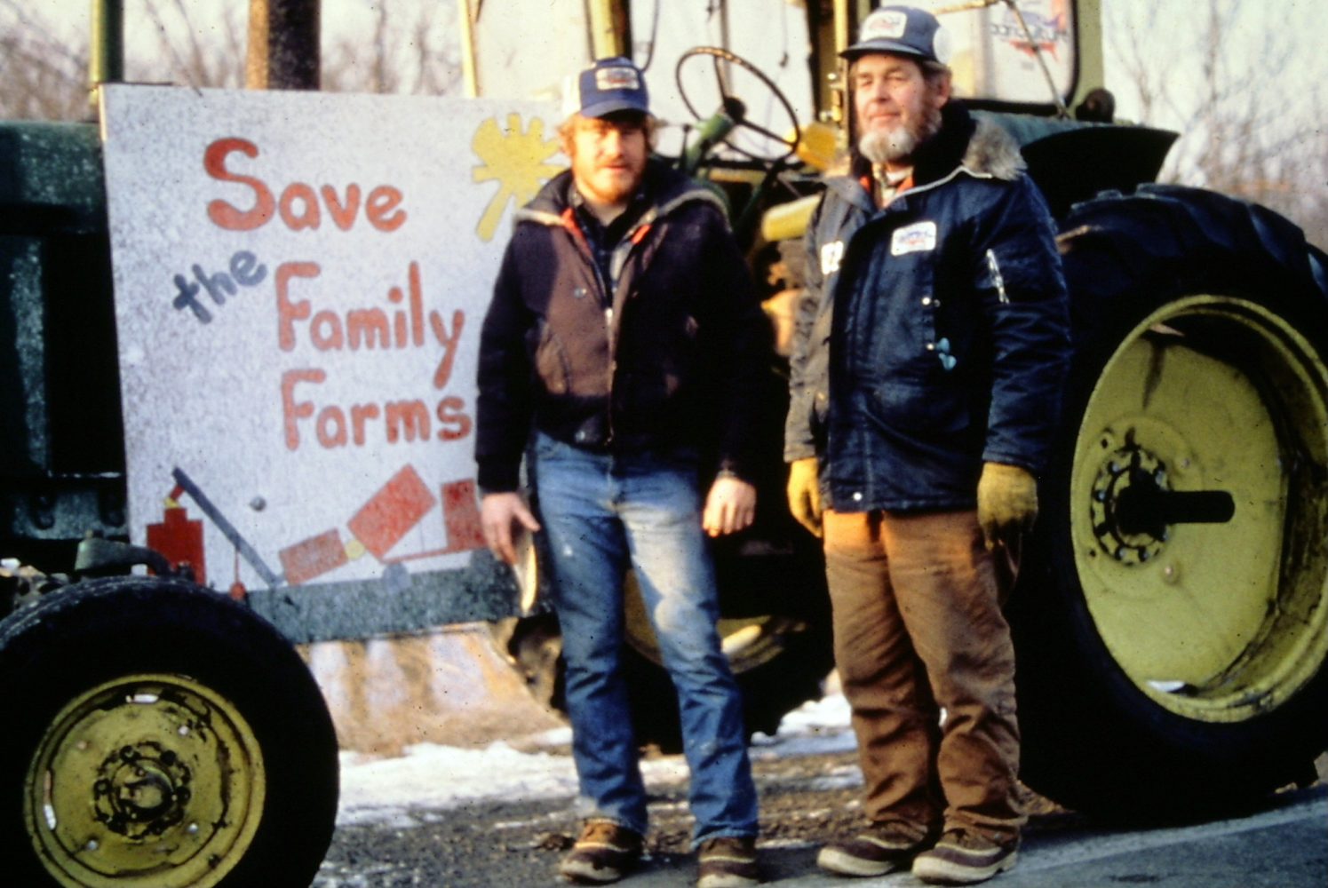 Kent and Chuck Kanten, family farmers from Milan, Minnesota, pose in front of their tractor. (Photo/Larry Long)
