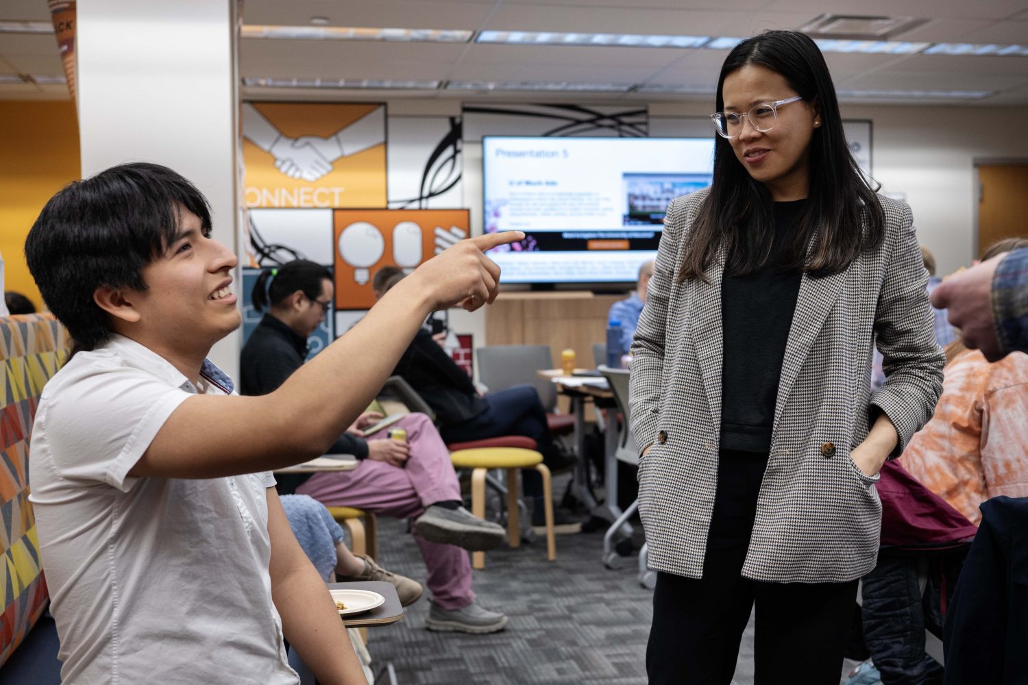 Rodrigo Rivera, who presented his video essay "A Case for Dark Short Stories," talks with Jade Cabagnot, the Director of Engagement, Outreach, and Community Partnerships, at the Creators Showcase on April 14, 2025. (Photo/Adria Carpenter)