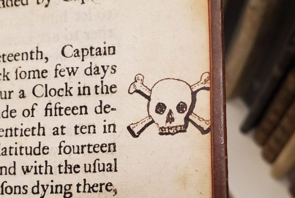 Skull and cross-bones drawn in the margin of a page.