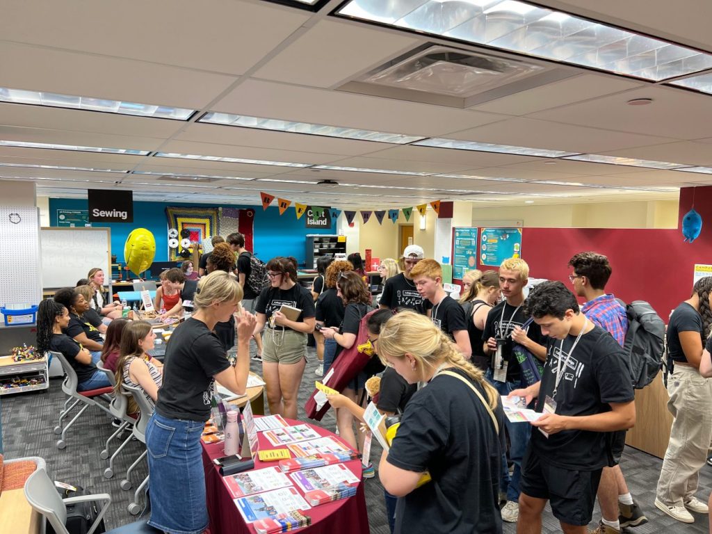New students visit information tables at the Toaster Innovation Hub during College Welcome Days