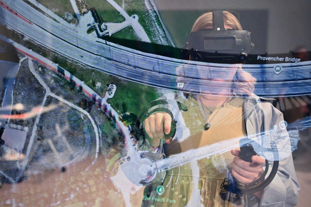 student in virtual reality headset superimposed over Google Earth space view map