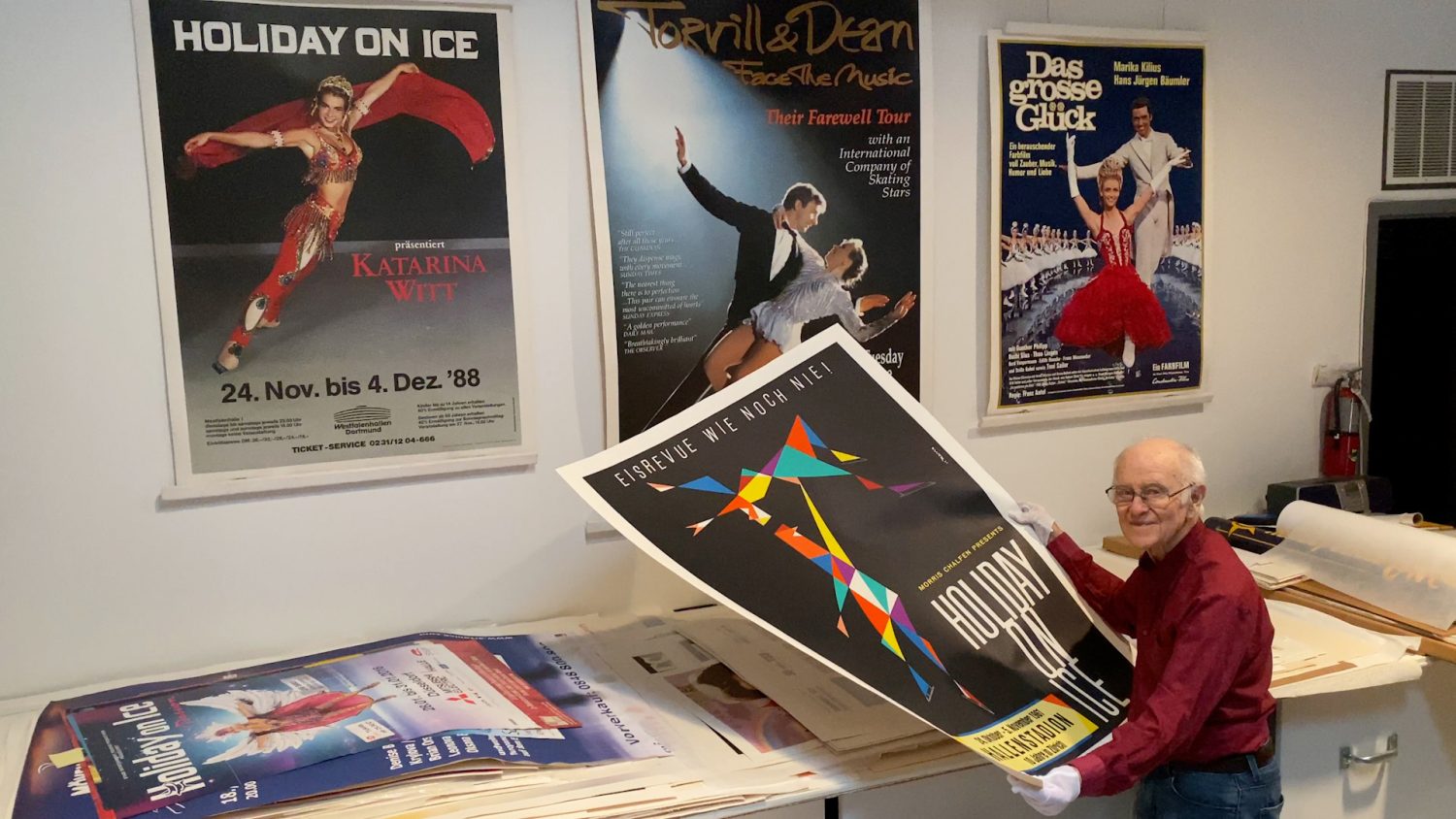 Roy Blakey holds one of the large ice show posters from his collection. Courtesy of Keri Pickett.